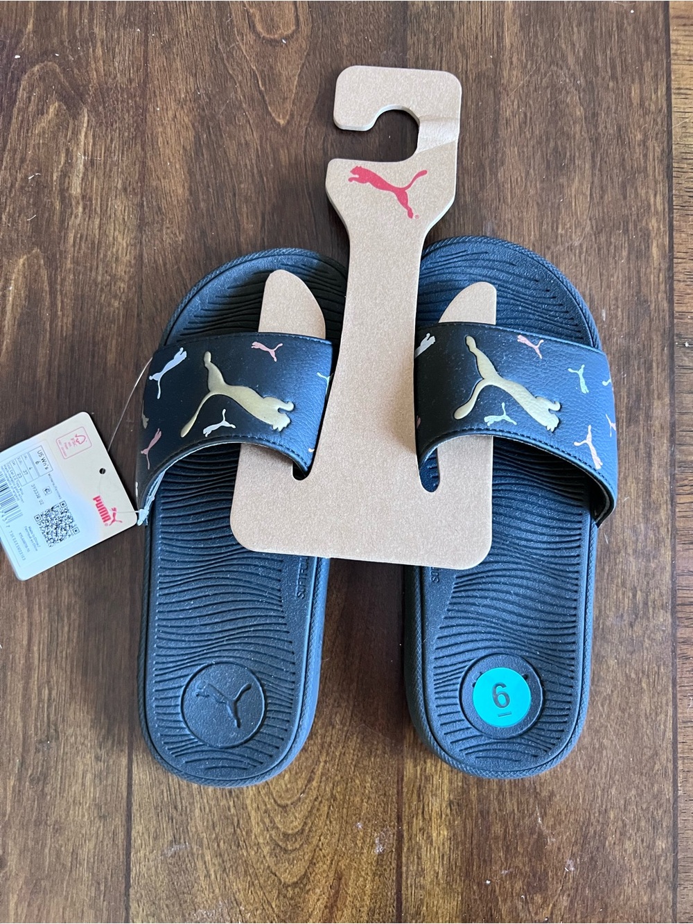 Puma Woman’s Black Slides with Gold and Pink Puma Logos